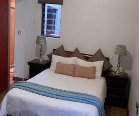 Thea's Place - Private Double Room with onsuite main bedroom and equipped office - Free WIFI and DSTV - Estate boasts a restaurant, swimming pool, green parks and lovely boutique venue for weddings or conferences